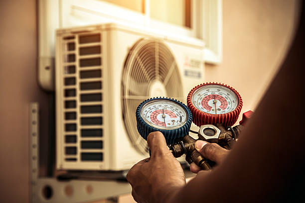 Professional Furnace Repair technician working in Sand Lake, NY